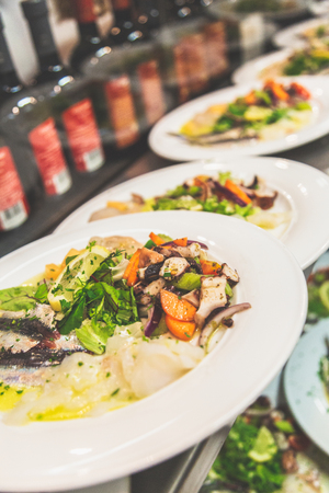 Seafood salad in a line to be servedの写真素材