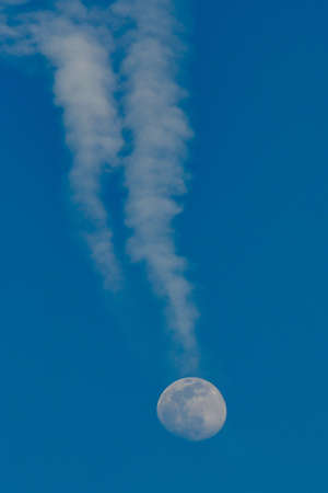 Photo of the Full Moon with Contrails, Early Spring 2020.の写真素材
