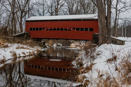Heikes Covered Bridge Reflections. The Heikes Covered Bridge is a historic covered bridge in Huntington Township, Adams County, Pennsylvania. It was built in 1892, and is a 67-foot-long, Burr truss bridge. The bridge crosses Bermudian Creek. It is one of のeditorial素材