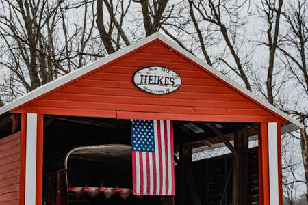 Adams County Covered Bridge. The Heikes Covered Bridge is a historic covered bridge in Huntington Township, Adams County, Pennsylvania. It was built in 1892, and is a 67-foot-long, Burr truss bridge. The bridge crosses Bermudian Creek. It is one of 17 covのeditorial素材