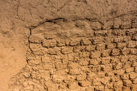 A close-up view of the brickwork of a traditional Arab mudbrick houseの写真素材