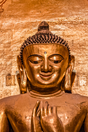 South facing standing Buddha - Kassapa, direct view of the face - look with mirthfulness, the Ananda Temple, Old Bagan, Myanmarの写真素材