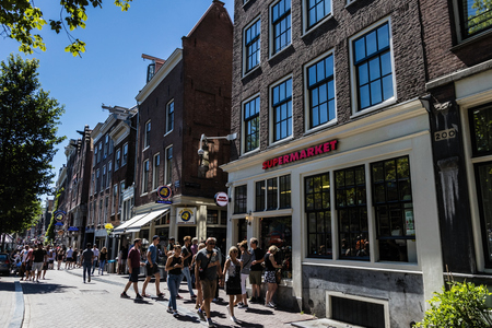 Crowded Oudezijds Voorburgwal, a street in the red lights district of Amsterdamのeditorial素材