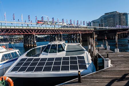 A modern  motor boat with solar panels moored at the Darling Harbor marina, Sydneyの写真素材