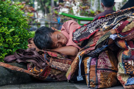 A man sleeping on the street of Yogyakarta, Indonesiaのeditorial素材
