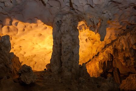 Stalactite and stalagmite formations in a limestone cave of Halong Bay, Vietnamの写真素材