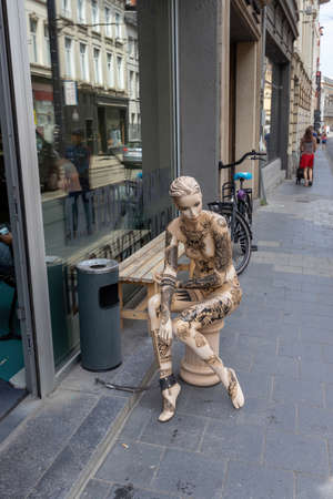 Ghent, Belgium - July 13, 2018: A decorated female mannikin at the entrance to the tatoo studioのeditorial素材