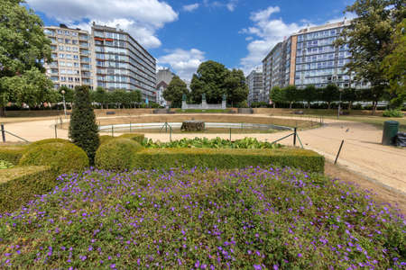 Square Ambiorix, a green space with public gardens, walking paths, ponds, a waterfall and 19th-century sculptures. Brussels, Belgiumの写真素材