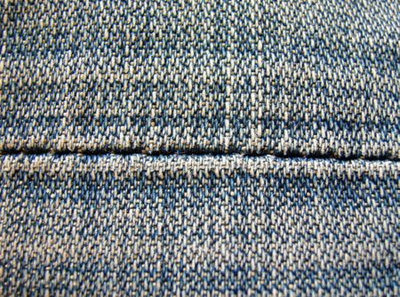 Macro detail of an old pair of blue jeans.           