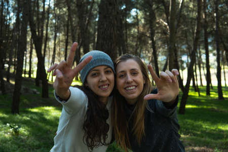 Two latin women smiling in the natureの写真素材