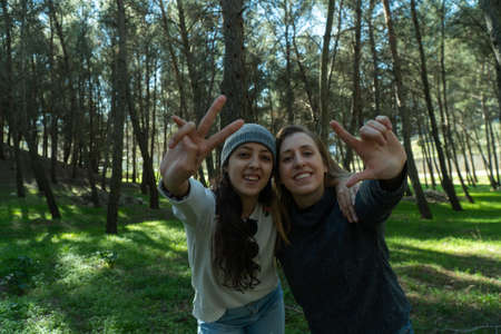 Two latin women smiling in the nature