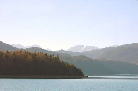 Zugspitze, the highest mountain of Germanyin Bavaria and Walchensee in the foregroundの写真素材