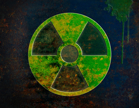 radiation sign on dark rusty metal plateの写真素材