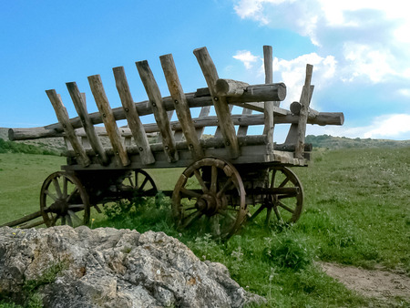 Old wagon standing at the top of the hill