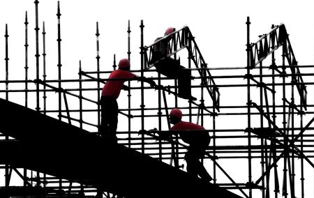 Construction Workers red shirts silhouettesの写真素材