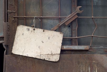 Blank cardboard sign in a factory, free copy space, grungeの写真素材