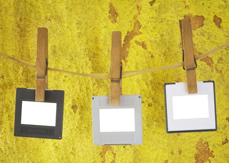 blank slides hanging on a rope,grungy background, freey copy and pix spaceの写真素材