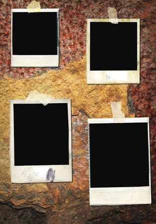 Blank,battered instant picture frames, on a rusty iron wall,free space for pixの写真素材
