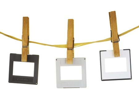 blank slides hanging on a rope,white background, freey copy and pix spaceの写真素材