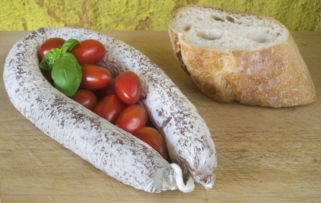 Salami with bread, tomatoes and basil, rustic ifoodの写真素材