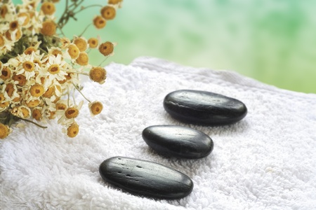 wellness and spa, pebbles, towel, dried chamomileの写真素材