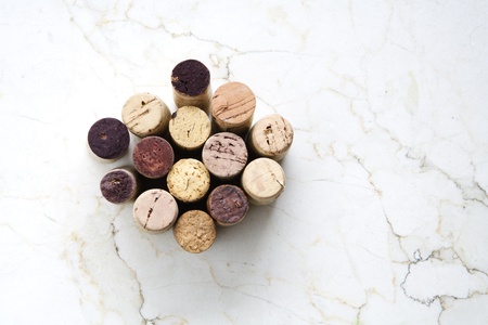 Various wine corks on a marble table, free copy spaceの写真素材
