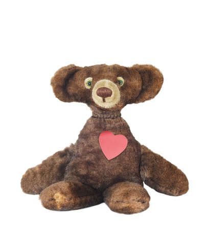 a vintage teddy bear with heart, isolated, copy space