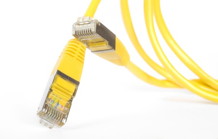 yellow network cable,close up, isolated on white background の写真素材