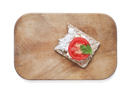 Crisp bread with cottage cheese, tomato and Italian parsley の写真素材