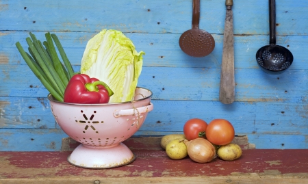 various vegetables and vintage kitchen equipmentの写真素材