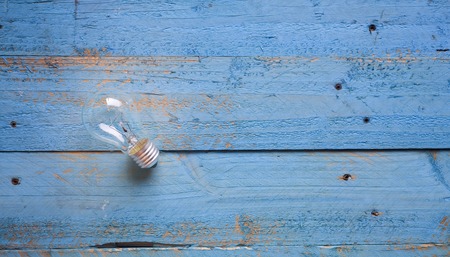 light bulb on blue backgroundの写真素材