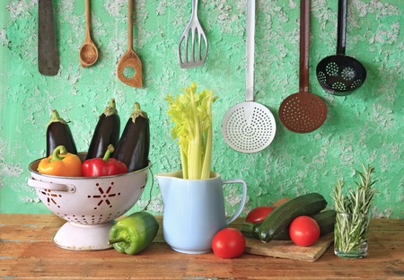 various vegetables and vintage kitchen utensilsの写真素材