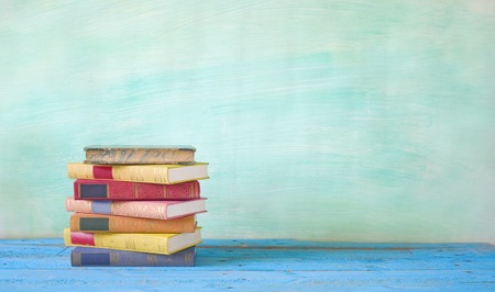 stack of books, grungy background, free copy spaceの写真素材