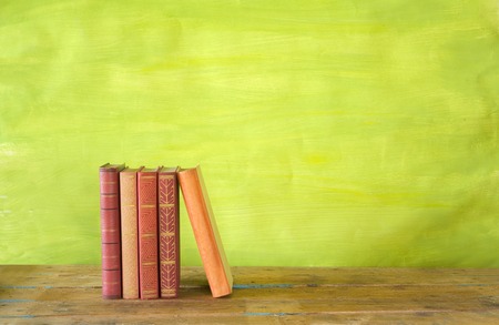 row of books, grungy background, free copy space 