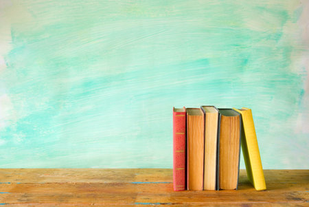 row of books, grungy background free copy space 