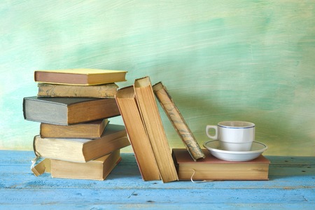vintage books and a cup of coffeeの写真素材