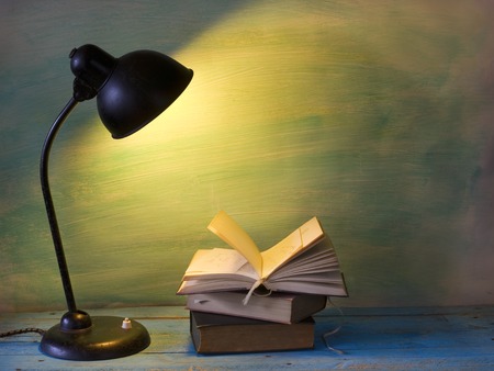 open book with vintage lamp, free copy spaceの写真素材