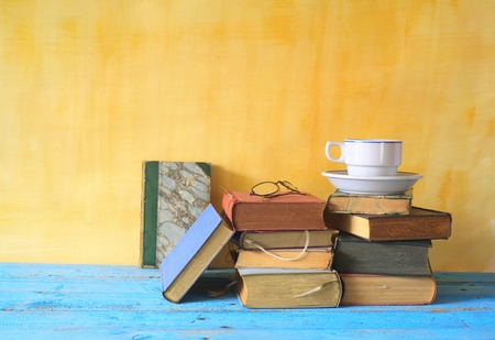 vintage books and a cup of coffee, free copy spaceの写真素材