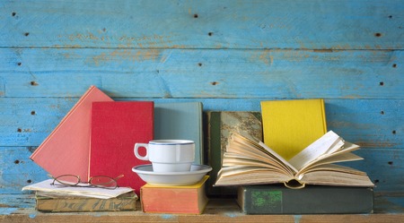 vintage books with coffee cup and specs, free copy spaceの写真素材