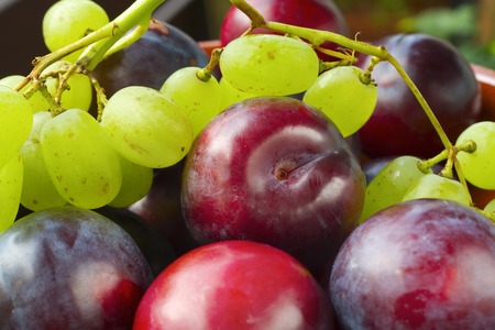 plums and grapes, close up,narrow focusの写真素材