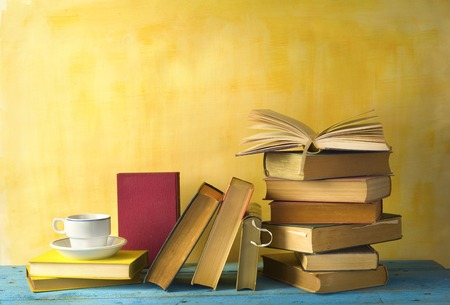 books and a cup of coffee, reading, learning concept, free copy spaceの写真素材