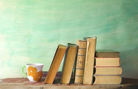 books and a cup of coffee, reading, learning concept, free copy spaceの写真素材