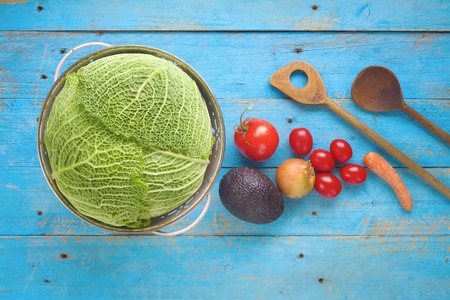 food ingredients, vegetables, wooden spoons, cooking concept