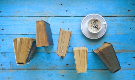 books and a cup of cappuccino, free copy spaceの写真素材