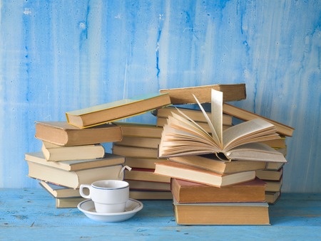 stacks of books and a cup of coffee, free copy spaceの写真素材