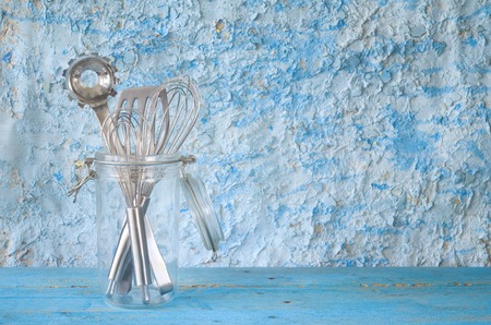 kitchen utensils in a glass jar, free copy space