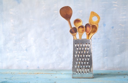 kitchen utensils, wooden spoons and grater, free copy spaceの写真素材