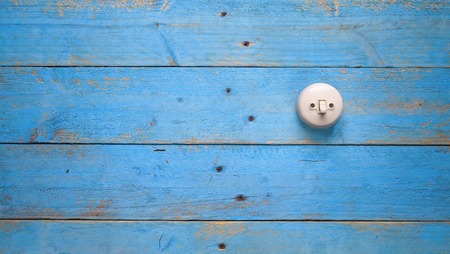 light switch on blue wood wall, free copy spaceの写真素材