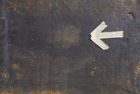 rusty iron plate with an arrow, free copy spaceの写真素材