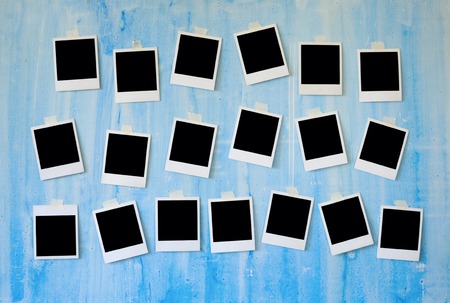 Instant photo frames on grungy background free space for picturesの写真素材